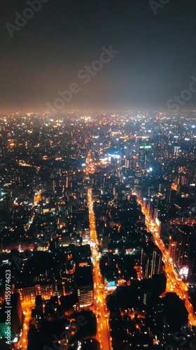 City skyline illuminated at night with busy highways and bright building lights in the background