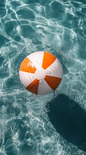 Colorful beach ball floating in clear water on a sunny day during summer fun