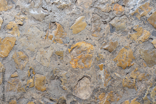 Palma de Mallorca, Spain 29.10.2021: Weathered sandstone texture detail of La Almudaina Palace wall