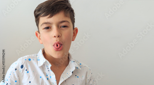 Принти на полотні A young boy, aged 6-8, practicing speech therapy exercises