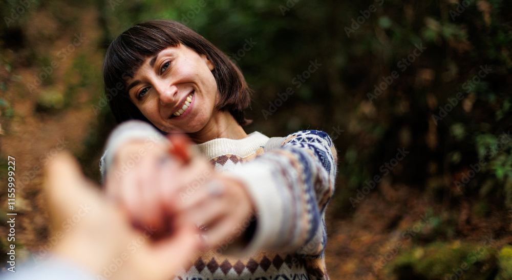 woman in a sweater and a backpack on her back travels. on a hike in the mountains. Young happy tourist woman relaxing in nature woman in a sweater and a backpack on her back travels. on a hike in the mountains. Young happy tourist woman relaxing in nature