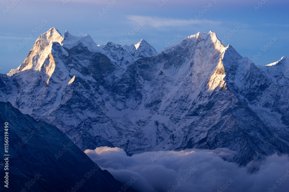 Fototapeta premium Himalayas, Thamserku summit at dawn above the sea of ​​clouds, view from Gokyo Ri peak, Sagramatha National Park