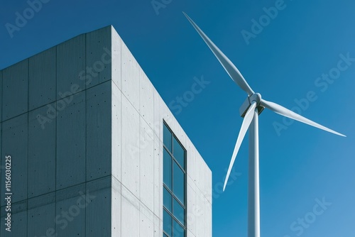 Modern concrete building with a wind turbine, symbolizing sustainable energy and architecture. photo