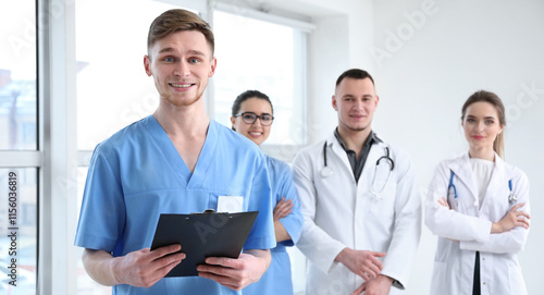 Male doctor and his colleagues in clinic