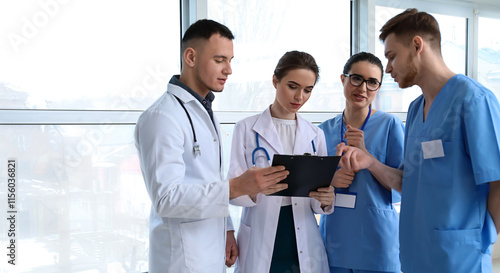 Team of doctors discussing ...