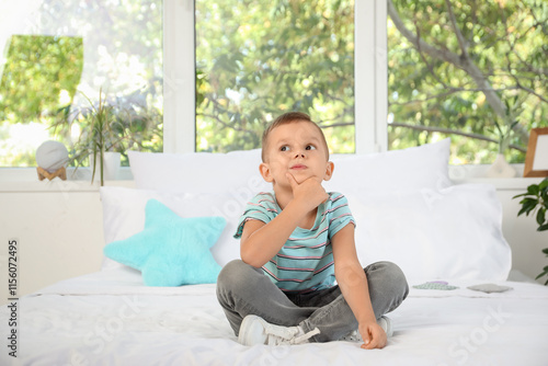 Wallpaper Mural Thoughtful little boy sitting in bedroom Torontodigital.ca