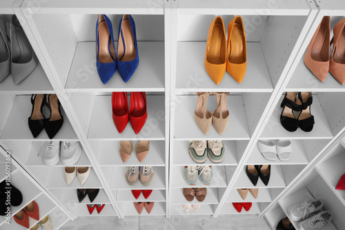 Organized white closet shel...