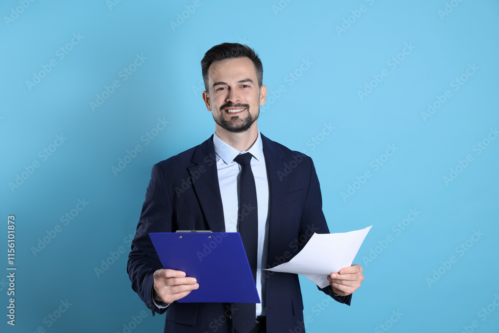 Smiling banker with clipboard on light blue background Smiling banker with clipboard on light blue background