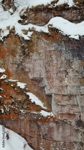 Wallpaper Mural A Beautiful Snowy Rocky Terrain Featuring Unique and Textured Cliffs and Stunning Views. Stock Clip Torontodigital.ca