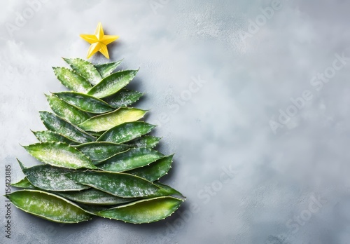 A Christmas tree crafted from pineapple leaves and adorned with festive decorations, embodying the holiday spirit. photo