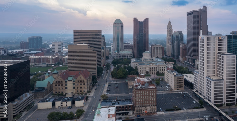 Fototapeta premium High-angle view of downtown Columbus, OH. Modern and historic buildings, including the Columbus Public Library, are visible. Urban landscape. DOWNTOWN, COLUMBUS, OHIO, UNITED STATES