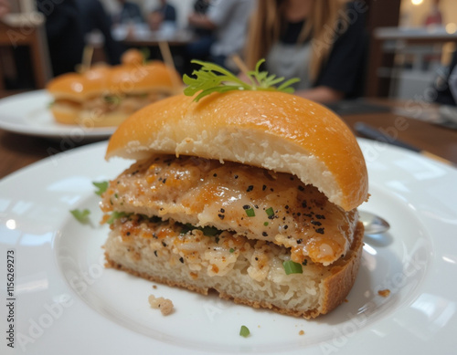 Bocadillo de pescado aliñado y pan de bollo photo