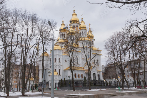 Church of the Holy Myrrh-Bearing Women and naked trees in the winter park of kharkiv photo