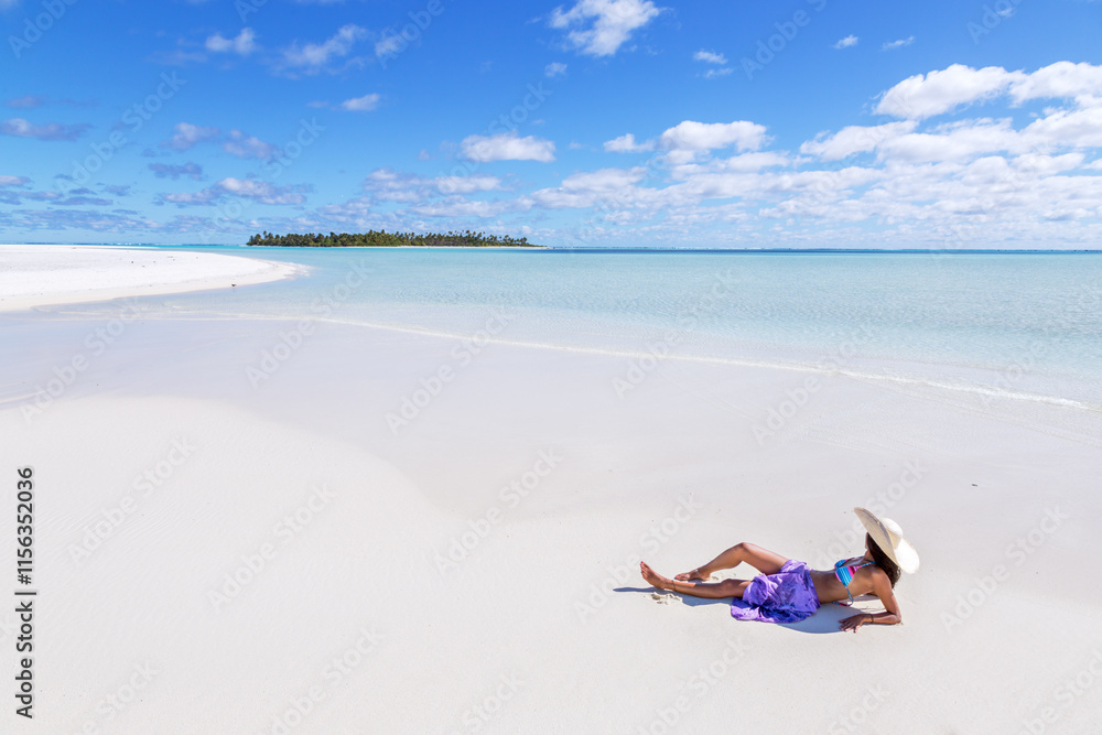 Beautiful woman laying down on a tropical beach, Honeymoon Island, Aitutaki, Cook Islands Beautiful woman laying down on a tropical beach, Honeymoon Island, Aitutaki, Cook Islands