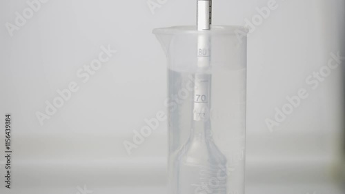 Distillation of braga into moonshine. Measurement of alcohol content.