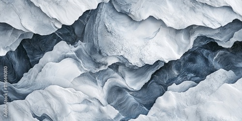 Wallpaper Mural Aerial view of rugged snowy mountain peaks showcasing dramatic shadows and textures in a winter landscape. Torontodigital.ca