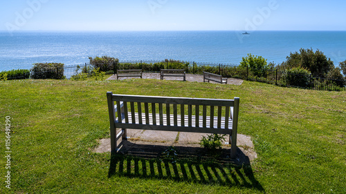 Bench in Folkestone harbour with a view of the Channel