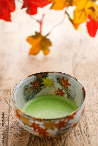 Cup of fresh matcha tea, green tea on wooden table