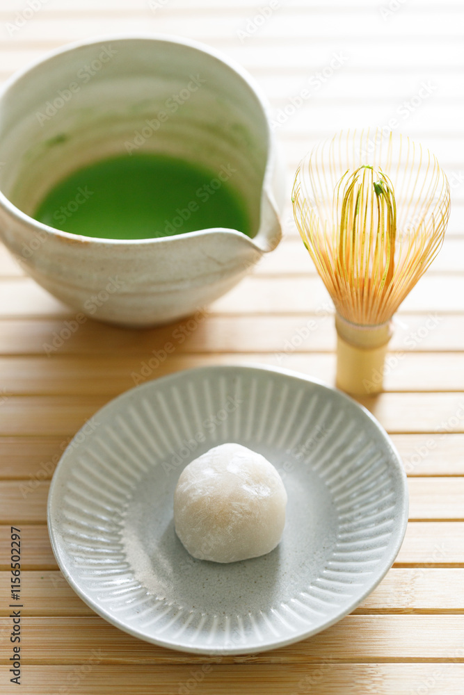 Cup of fresh matcha tea, green tea and Manju Cup of fresh matcha tea, green tea and Manju