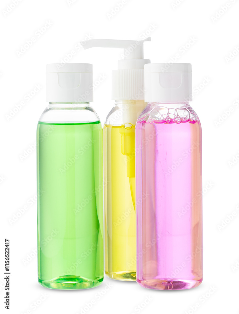 Various bottles with colored liquids and pumps arranged on white background Various bottles with colored liquids and pumps arranged on white background
