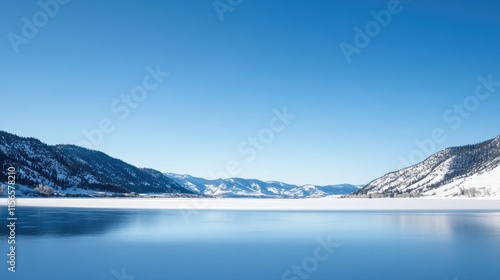 Wallpaper Mural Serene crystalline lake with snowy mountains under a clear blue sky ideal for winter travel imagery and promotional content use Torontodigital.ca