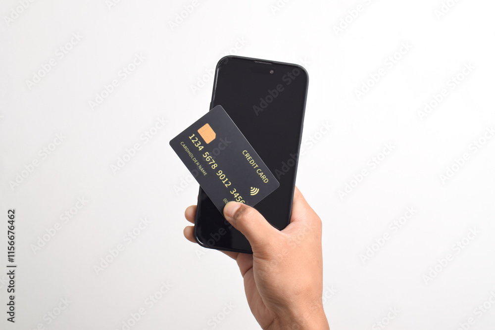 Male hands holding mobile phone and black credit card isolated on white background. Mobile payment ,Online shopping concept Male hands holding mobile phone and black credit card isolated on white background. Mobile payment ,Online shopping concept