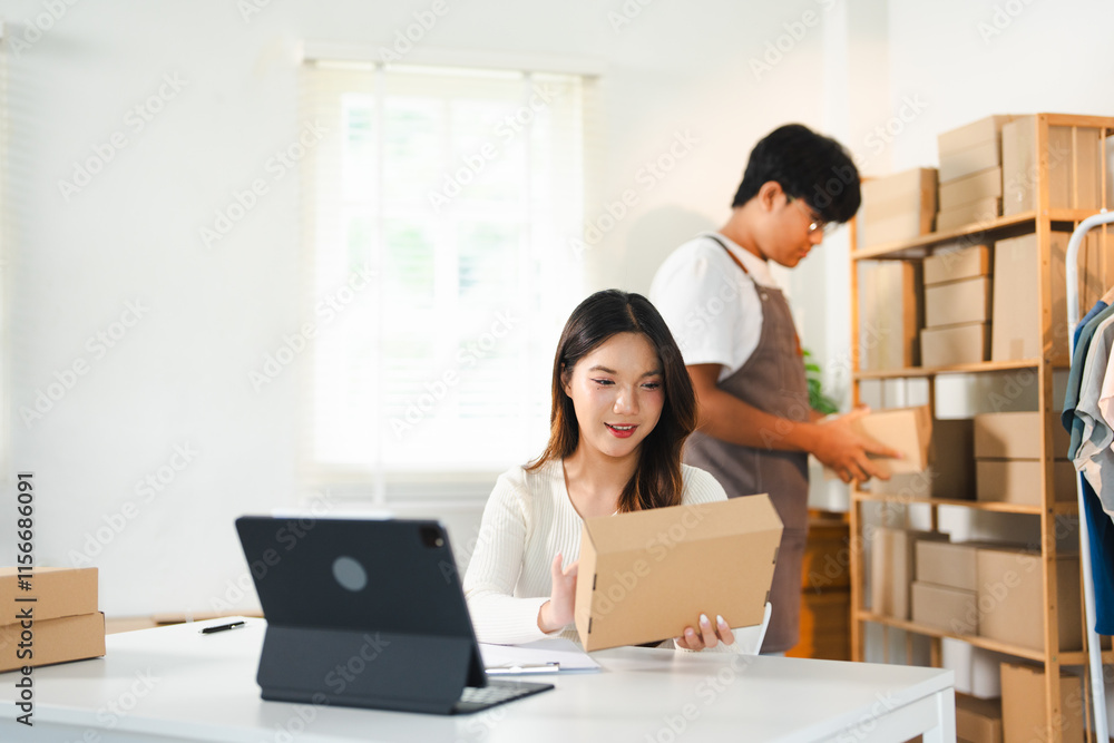 Small start-up and SME owner, an Asian male and female entrepreneur checking orders and packing for customers, self-employed, freelance, online selling. Small start-up and SME owner, an Asian male and female entrepreneur checking orders and packing for customers, self-employed, freelance, online selling.