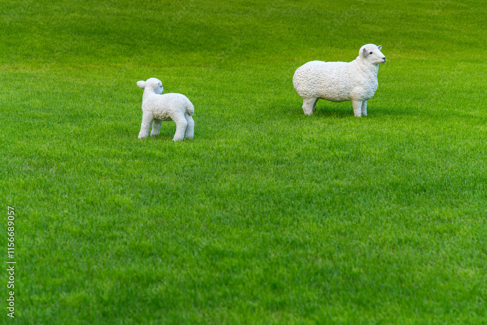 View of the sheep sculptures on the lawn in the park View of the sheep sculptures on the lawn in the park