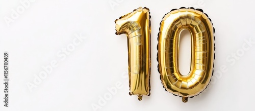 Gold and black helium foil number 10 balloon on white background ideal for birthday celebration anniversary and milestone party decoration photo