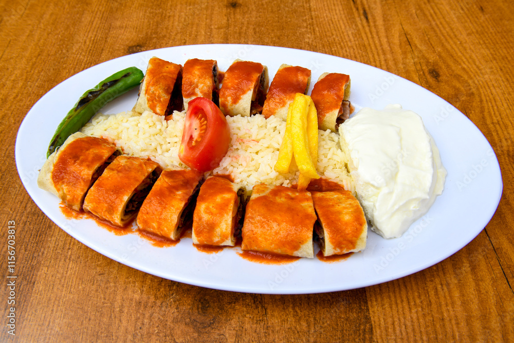 Famous Urfa meat liver, ciger wrapped by lavash with roasted chili pepper, onion and sauce in Sanliurfa, Turkey. Kuzu et ciger sis. Izgara dana bonfile, cop sis, kuzu pirzola. Karisik kebap, beyti keb Famous Urfa meat liver, ciger wrapped by lavash with roasted chili pepper, onion and sauce in Sanliurfa, Turkey. Kuzu et ciger sis. Izgara dana bonfile, cop sis, kuzu pirzola. Karisik kebap, beyti keb