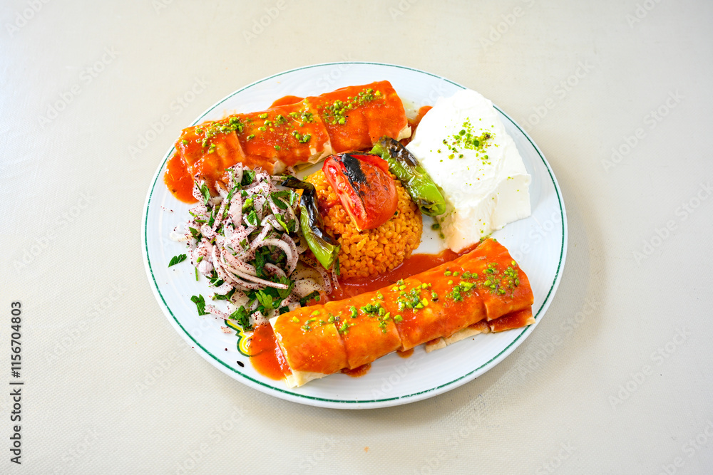 Famous Urfa meat liver, ciger wrapped by lavash with roasted chili pepper, onion and sauce in Sanliurfa, Turkey. Kuzu et ciger sis. Izgara dana bonfile, cop sis, kuzu pirzola. Karisik kebap, beyti keb Famous Urfa meat liver, ciger wrapped by lavash with roasted chili pepper, onion and sauce in Sanliurfa, Turkey. Kuzu et ciger sis. Izgara dana bonfile, cop sis, kuzu pirzola. Karisik kebap, beyti keb