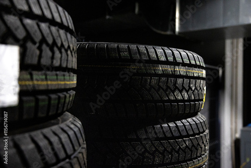Car tires stack at warehouse. Selective focus