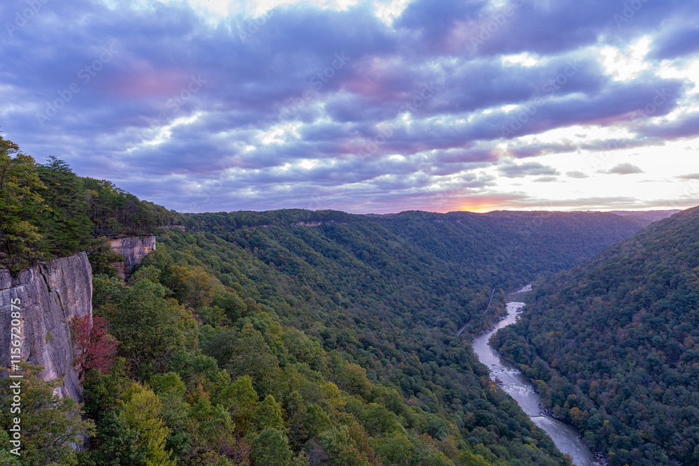 New River Gorge National Park, West Virginia, Endless Wall illuminated at sunrise during early autumn. New River Gorge National Park, West Virginia, Endless Wall illuminated at sunrise during early autumn.