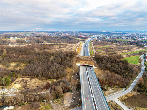 Obraz na płótnie New S52 highway, part of ring road around Krakow, Poland, opened for traffic on December 23, 2024. A green bridge for wild life migration. Aerial view w salonie