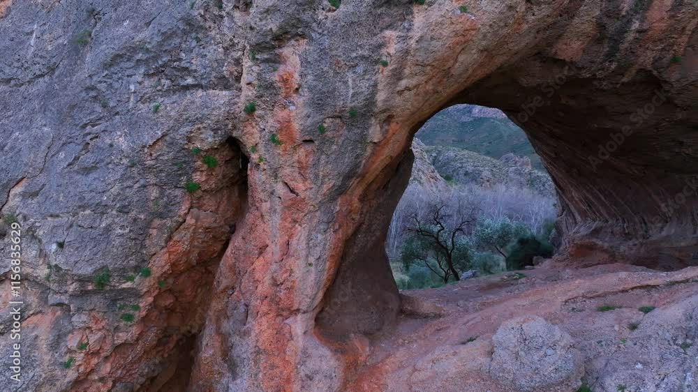 Aerial view from a drone of the Natural Stone Arch in the Jalon River in Chodes. Valdejalón Region. Zaragoza Province. Aragon. Spain. Europe Aerial view from a drone of the Natural Stone Arch in the Jalon River in Chodes. Valdejalón Region. Zaragoza Province. Aragon. Spain. Europe