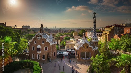 BARCELONA, SPAIN - NOVEMBER 9, 2024: Stunning sunset over Parc Guell, showcasing architectural beauty and vibrant surroundings in a scenic setting