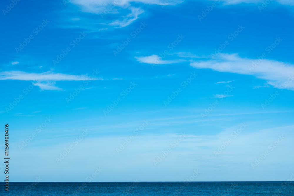 Obraz premium Nature of the beach and sea Summer with sunshine, sandy beaches, clear blue waters sparkling against the blue sky. On an island with good ecology and environment Background for summer vacation