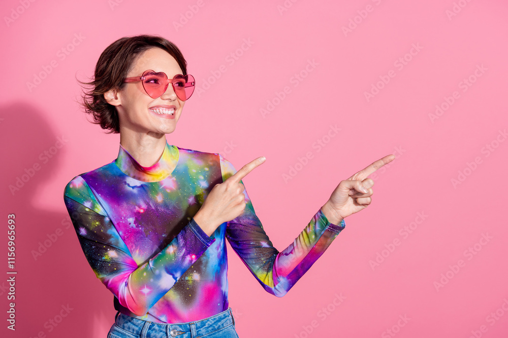 Portrait of pretty girl direct fingers empty space wear pullover isolated on pink color background Portrait of pretty girl direct fingers empty space wear pullover isolated on pink color background