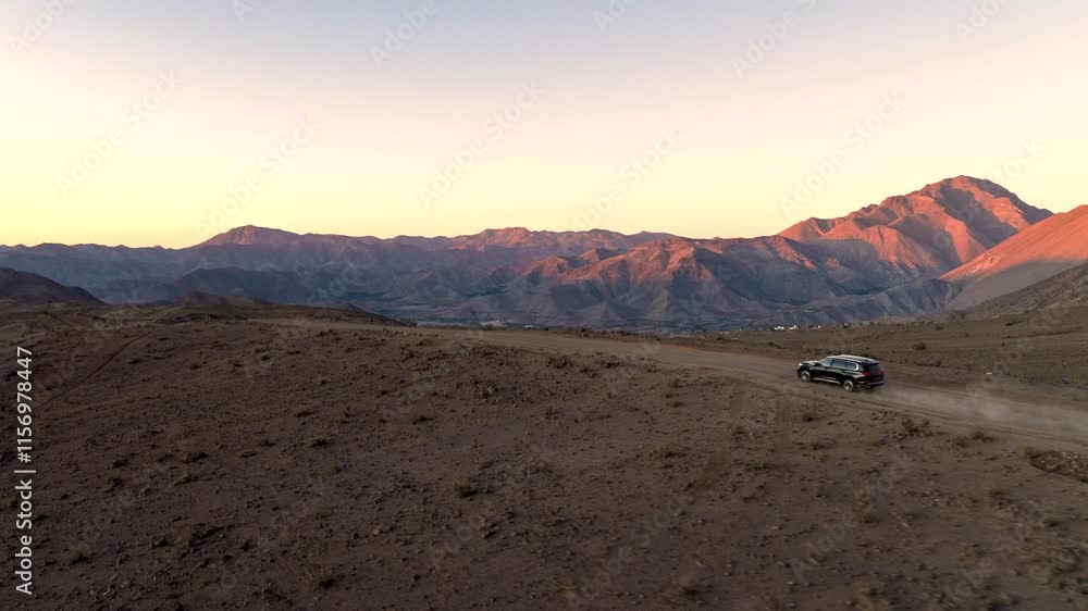 Chile desert north sand dunes lonely car passing by drone dusk morning Chile desert north sand dunes lonely car passing by drone dusk morning