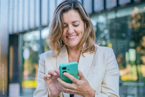 Smiling Mature Woman Using Smartphone Outdoors