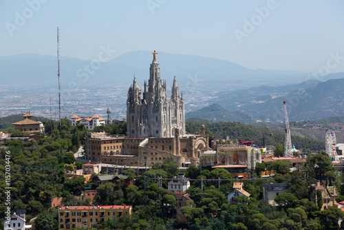 Tibidabo amusement park and expiatory church of the sacred heart of jesus dominating barcelona cityscape photo