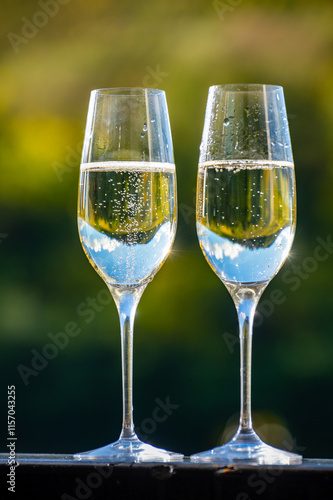 Tasting sparkling white wine, traditional champagne method making of cremant in caves on Moselle river valley in Luxembourg, glass of wine photo