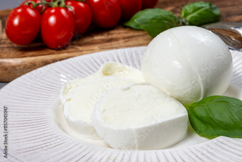 Tasty italian food, fresh white buffalo mozzarella soft cheese balls from Campania close up photo