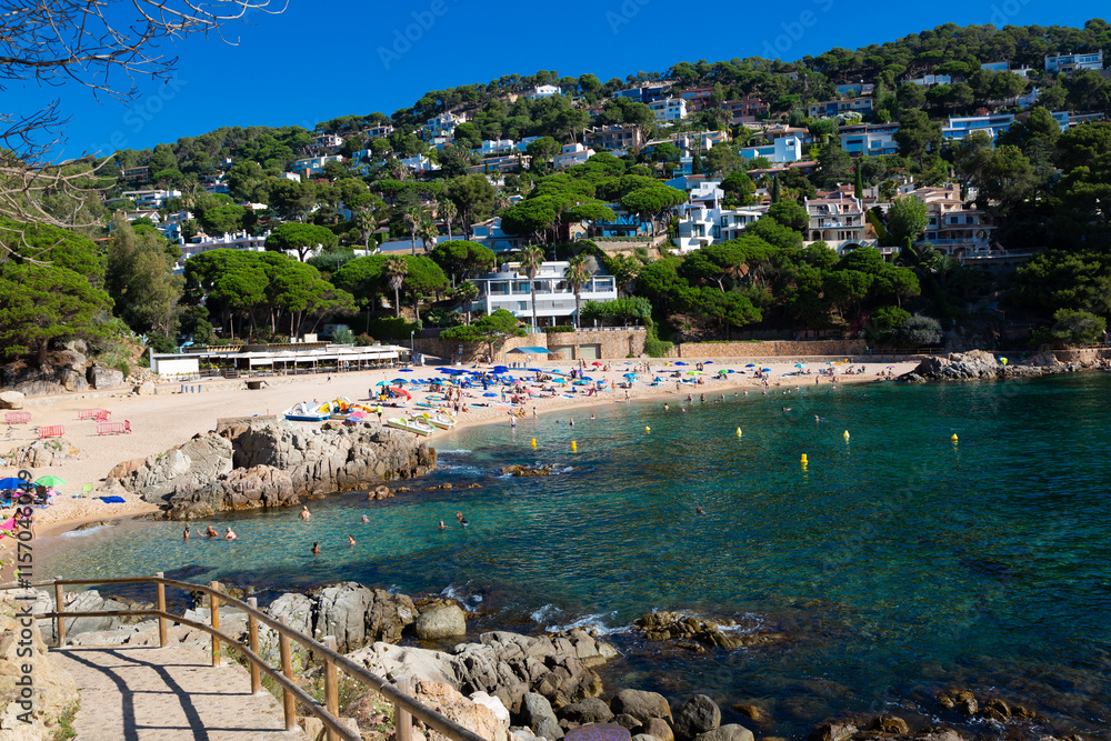 Beautiful turquoise mediterranean sea washing rocky coastline on sunny summer day