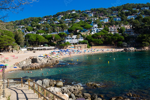 Obraz na płótnie Beautiful turquoise mediterranean sea washing rocky coastline on sunny summer day w salonie