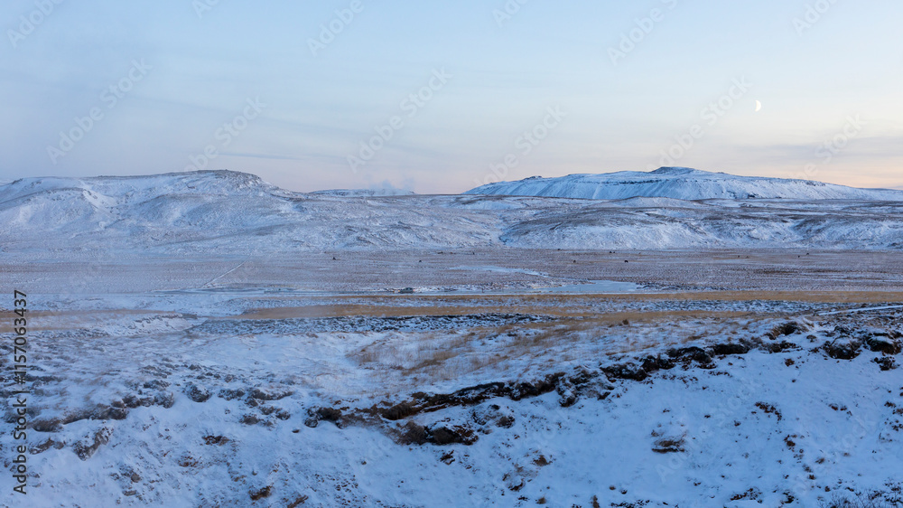 Winter landscape with steam coming out of the ground due to volcanic activity. Geothermal area Seltun at Reykjanes peninsula in ICeland. Winter landscape with steam coming out of the ground due to volcanic activity. Geothermal area Seltun at Reykjanes peninsula in ICeland.
