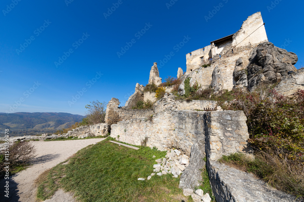 Ancient ruin at a hill over Duernstein village in the Wachau Valley in Austria. Famous tourist destination in Austria. Ancient ruin at a hill over Duernstein village in the Wachau Valley in Austria. Famous tourist destination in Austria.