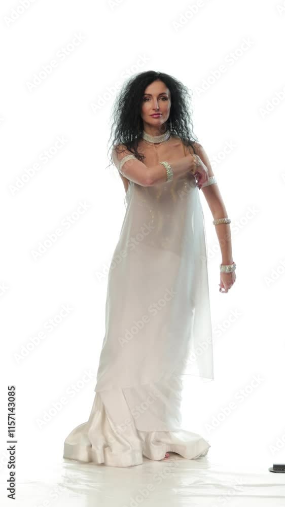 Dancer in oriental costumes dance belly dance on the background Dancer in oriental costumes dance belly dance on the background