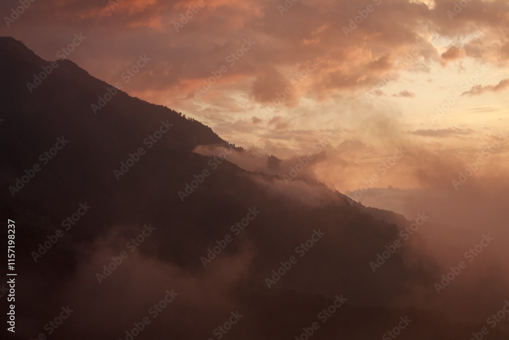 Misty mountains at dawn, shrouded in a soft veil, create a magical atmosphere of tranquility and mystery of nature Misty mountains at dawn, shrouded in a soft veil, create a magical atmosphere of tranquility and mystery of nature
