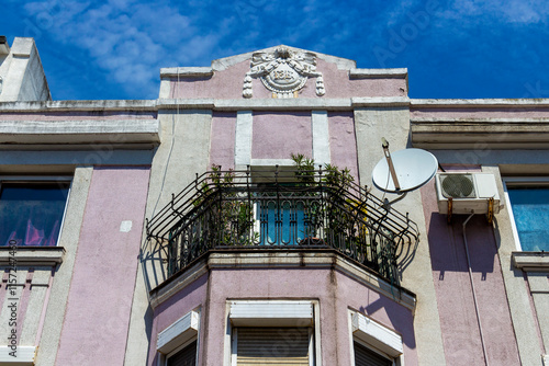 Beautiful old building with stucco decoration in the city center of Burgas, Bulgarian Black Sea coast, partial facade view